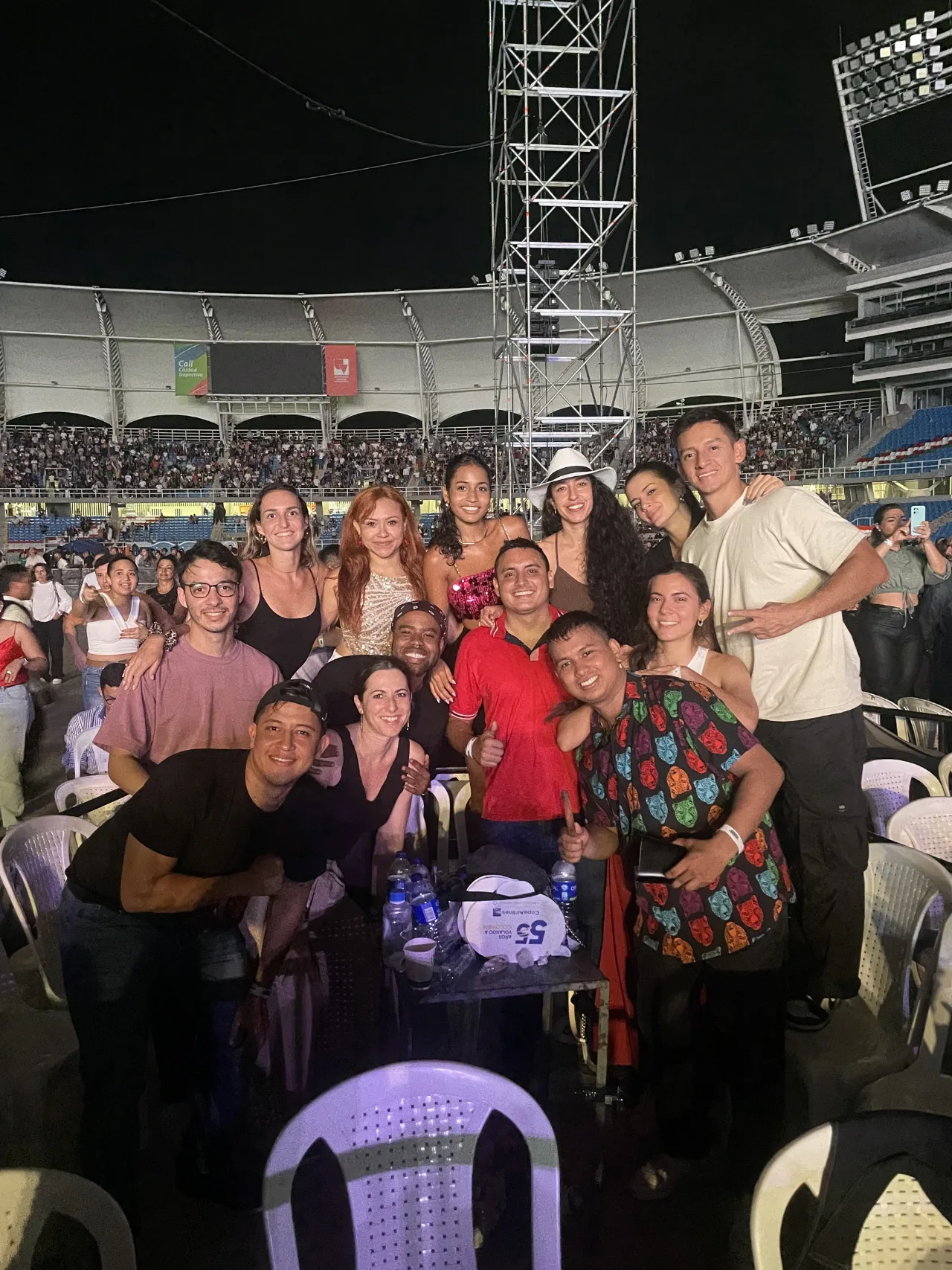 Large international group together at a concert during Feria de Cali 2024.
